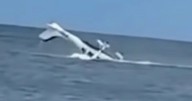 Pilot cheats death as horrifying footage shows plane crashing into ocean