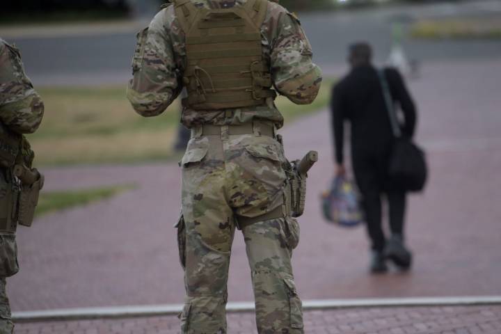 Some National Guard units in Washington are now carrying firearms in escalation of Trump deployment