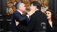 Brawl in Mexican parliament sees lawmakers shove each other and photographer pushed over as row breaks out over cartels