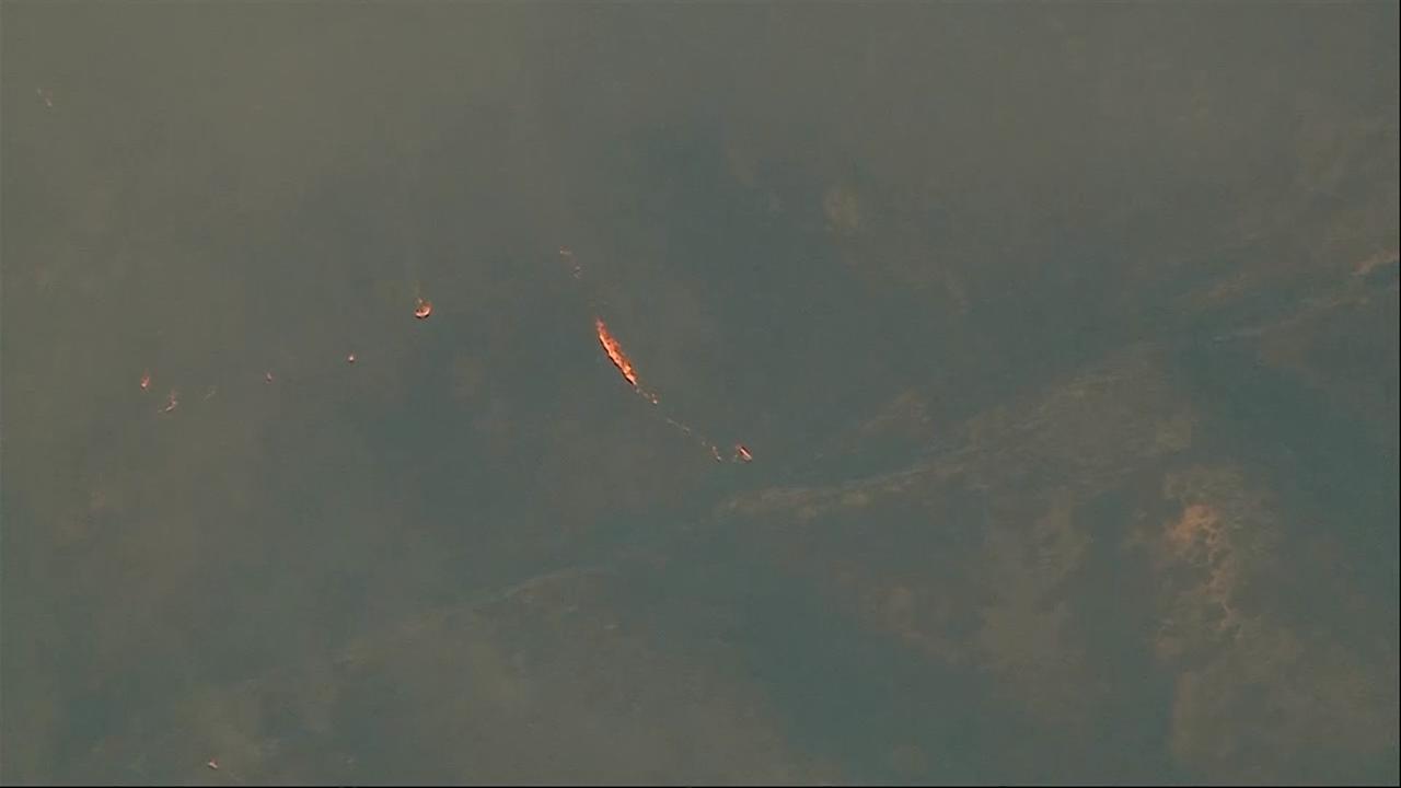 Fast-growing brush fire forces thousands to evacuate north of Los Angeles
