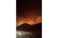 Firefighters make progress against fast-moving blaze along highway north of Los Angeles