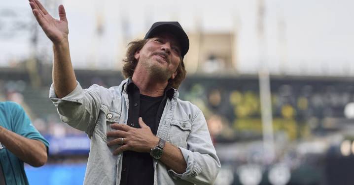 MLB's newest trophy is a guitar. Obviously, Eddie Vedder had to give it a test drive