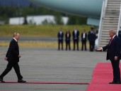 Trump and Putin share handshake in Alaska, a warm greeting belying the bloodshed in Ukraine