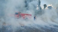 Pasture fire burns in Newton, officials urge caution