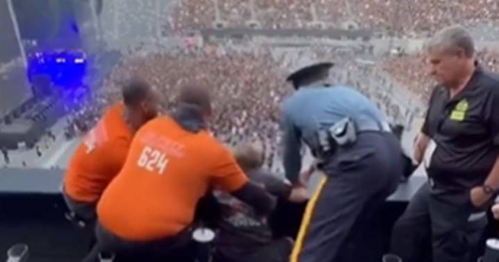 Man caught pleasuring himself at heavy metal concert beaten then dragged out by cops