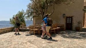 Three die in Greece as gales stoke fires, disrupt ferries
