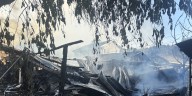 Fire destroys home, damages nearby garages; sends one to hospital