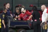 Angels’ Taylor Ward carted off field after crashing into scoreboard