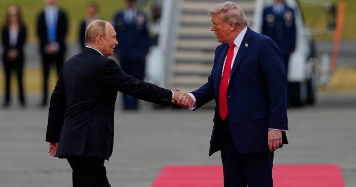Trump and Putin shake hands warmly on the tarmac before their summit on the Russia
