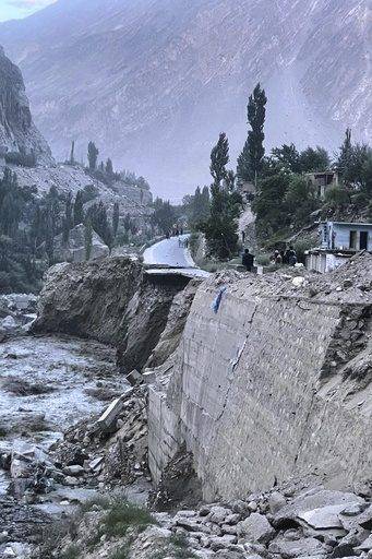 Flash floods triggered by heavy rains kill at least 49 people in northwestern Pakistan