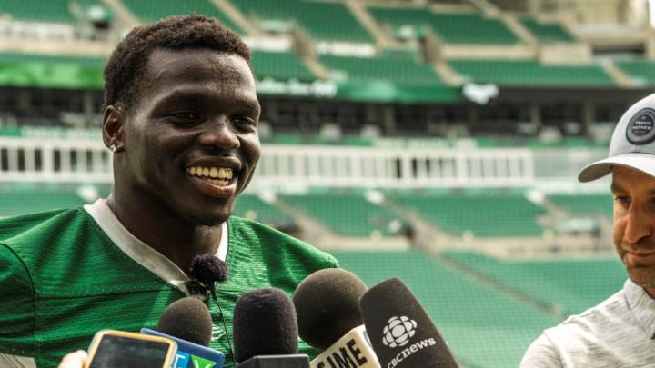 ‘Home is where the heart is’: Roughriders’ Ajou Ajou excited about return to CFL field in Saskatchewan