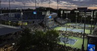 At the US Open, tennis stars shine under dark sky