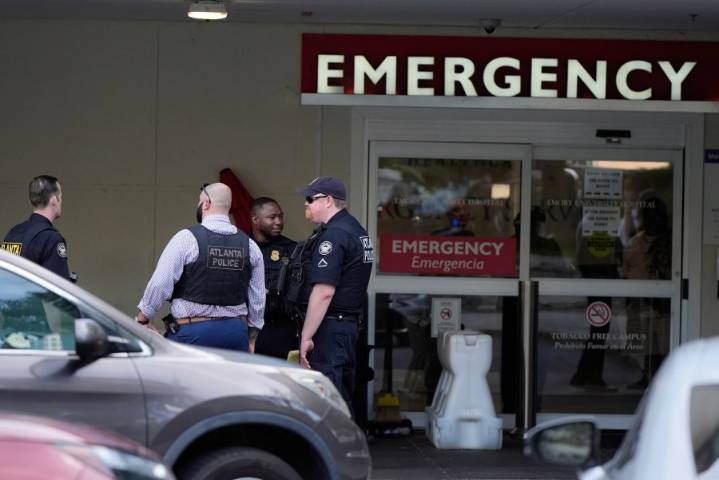 Suspected gunman and police officer dead in shooting near the CDC and Emory University, police say