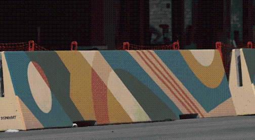 Painted concrete barriers now line part of Sixth Street