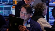 World shares are mixed in quiet trading as traders await cues from the Fed