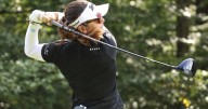 Miranda Wang waits a long time for a short birdie and leads rain