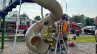 Firefighters cut open playground slide to rescue 40