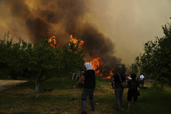At least 3 dead and thousands displaced as wildfires rage across southern Europe