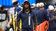 CeeDee Lamb hit by ref on sideline, drawing penalty flag