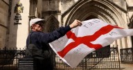 UK wins court ruling to keep asylum seekers in hotel but risks angry response