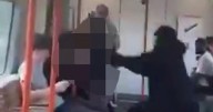 Shocking moment schoolboy is 'beaten up by man' on London Overground train
