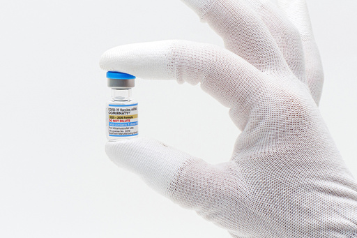 FDA approves updated COVID-19 shots with limits for some kids and adults