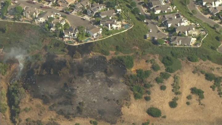 VIDEO: Firefighters stop brush fire from reaching nearby home in Laguna Niguel