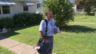 Beloved mail carrier retires after 44 years leaving behind heartfelt stamp