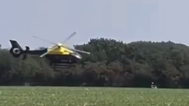 Police helicopter swoops scarily close to ground in motorbike chase