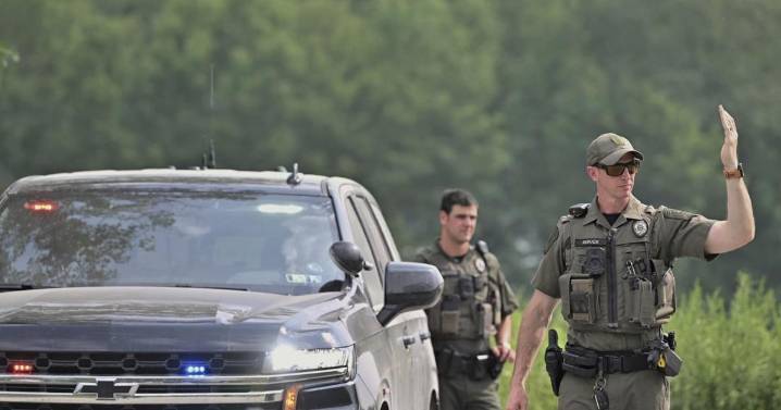 Woman killed by neighbor before responding state troopers were ambushed by gunfire, police say