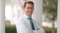 A law professor was stalked and killed by hit men. His former mother-in-law is now on trial for the 2014 contract killing