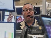 Wall Street pulls back from its latest all