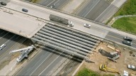 Bridge beams installed at the Exit 18 overpass. What’s next for the project?