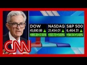 DOW soars into record territory as Powell hints at rate cut