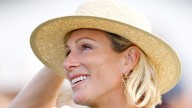 Zara Tindall pictured on summer break in slim-fit jodhpurs and riding boots