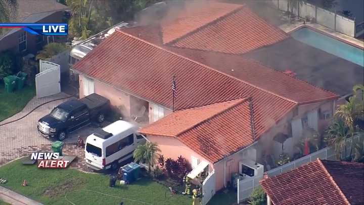 Crews respond to massive house fire in SW Miami