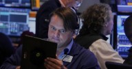 A late push sends Wall Street near its records