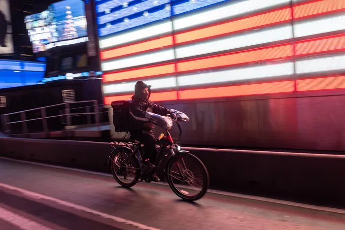 Adams vetos bills guaranteeing minimum pay to grocery delivery workers