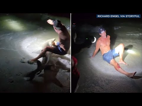 Man bitten while taking photo with shark