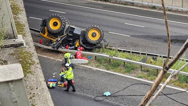 Man seriously injured after tractor falls off bridge on to M20