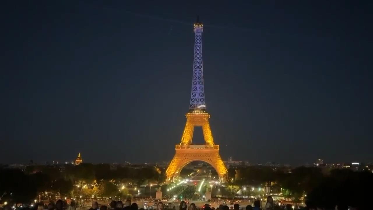 Eiffel Tower lit up in the colours of the Ukrainian flag
