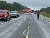 Driver flown to hospital after trucks crash head