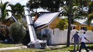See the photos: House crushed by crane on Merritt Island