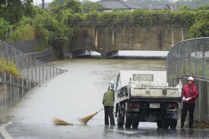 Torrential rains in southern Japan cause flooding, mudslides, and travel disruptions