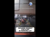 Bizarre moment car flips in parking lot