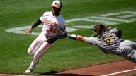 Willie MacIver hits a 2-run double in the 9th to rally Athletics over Orioles