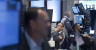 Stocks close mixed as Dow just misses a record high