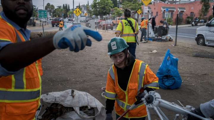San Diego City crews clean up homeless camps along freeways