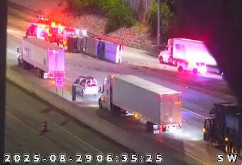 Overturned semi slows traffic on I