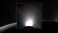 Cassini Captures An Unlikely Rainbow Above Enceladus, Puzzling Astronomers